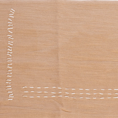 Tire-bouchon en coton slub beige brodé à la main