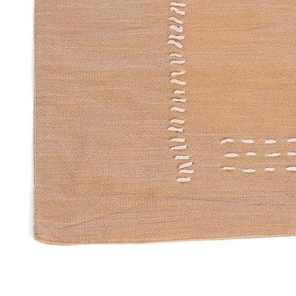 Tire-bouchon en coton slub beige brodé à la main