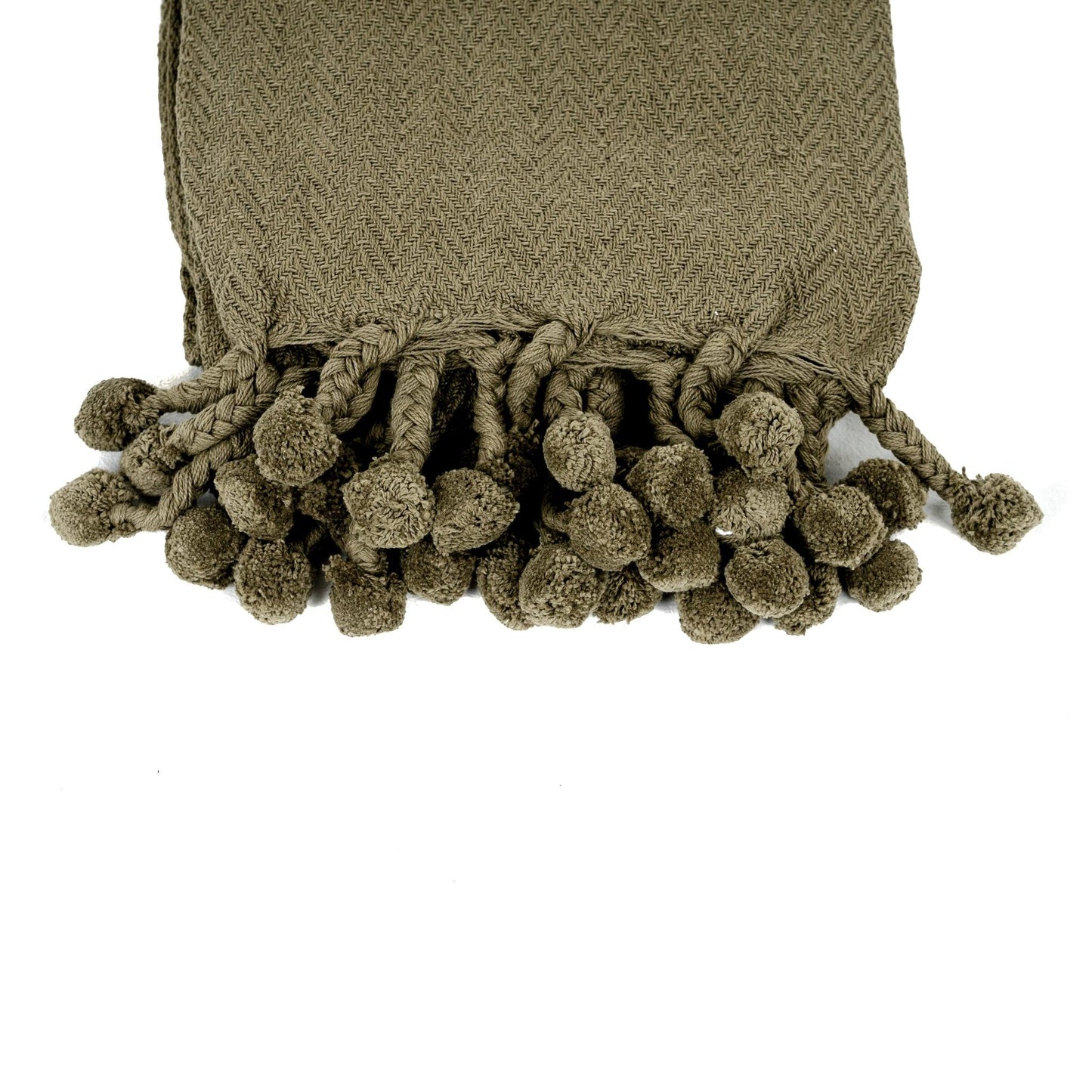 Lé pour lit en coton Vesla avec pompons tressés verts.